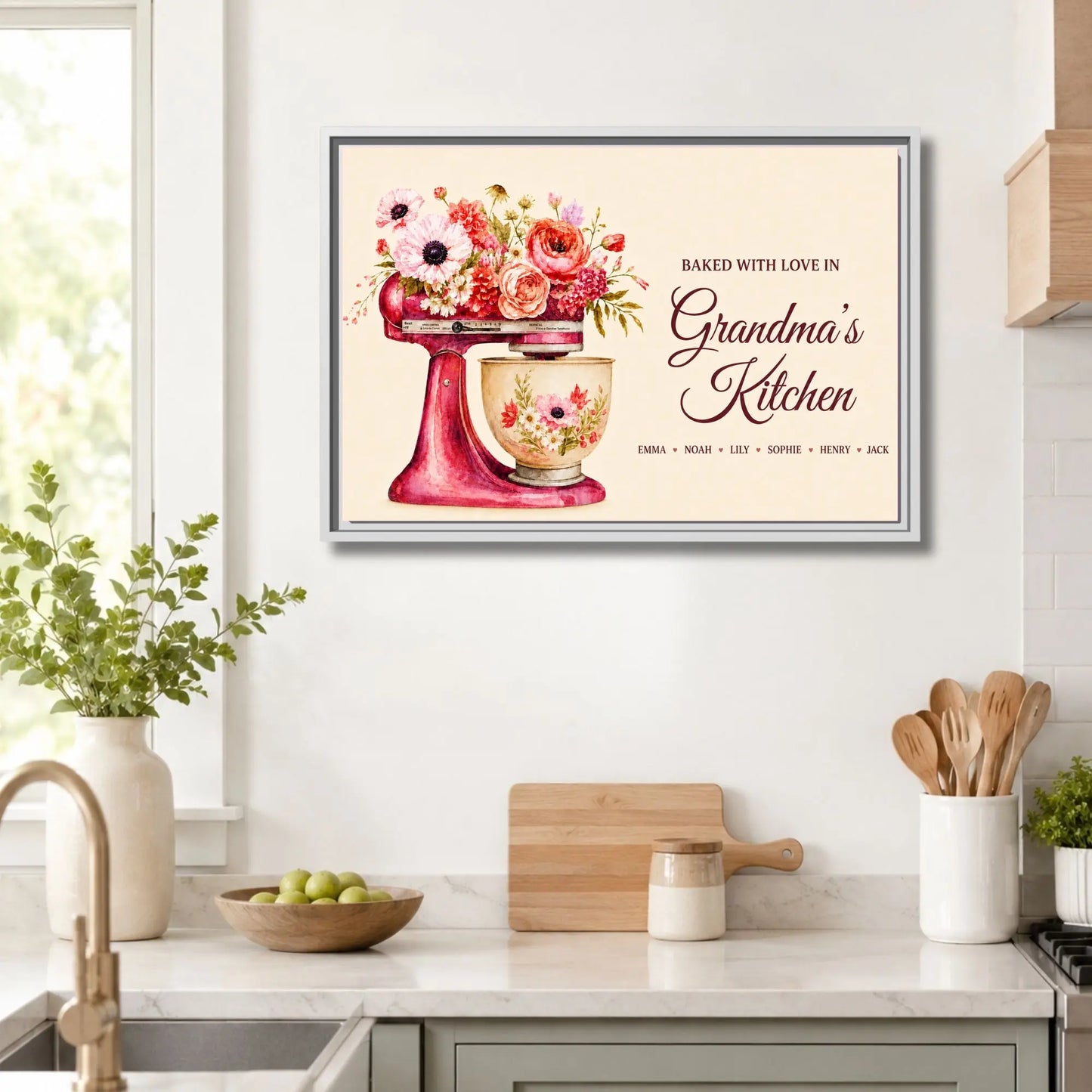 Decorative kitchen wall art with a mixer and flowers in a frame, placed above a kitchen counter.